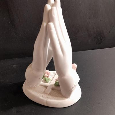 Porcelain praying hands with girl with flowers in her hands