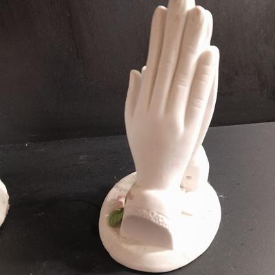 Porcelain praying hands with girl with flowers in her hands