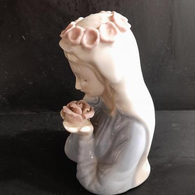 Porcelain praying hands with girl with flowers in her hands