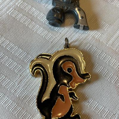 Skunk pendant and other trinkets