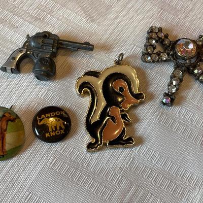 Skunk pendant and other trinkets