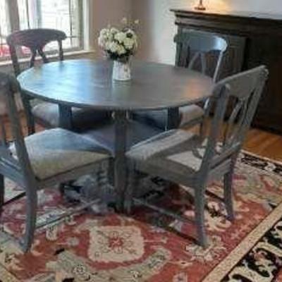 Table and 4 chairs. $375.00