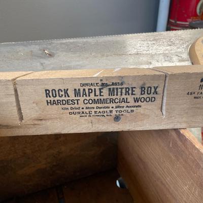 Saw and level in vintage crate