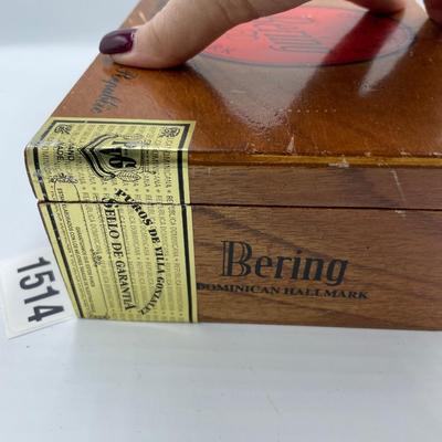 Bering cigar box full of buttons