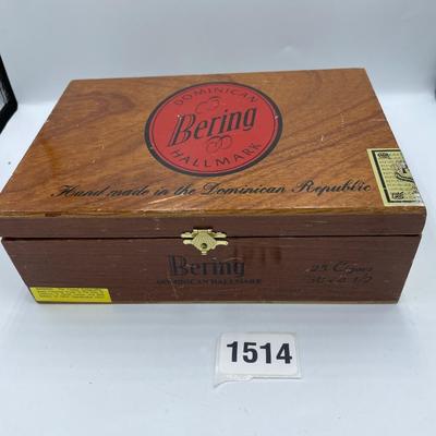 Bering cigar box full of buttons