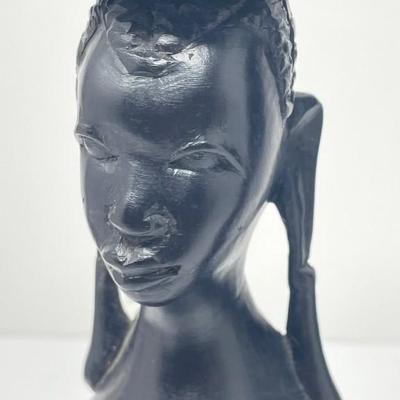 2 matching candle sticks with facial carving