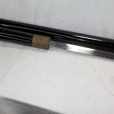 Walking Cane-sword with pull out/ 36 in. / 17 in sword..est. $50 to $150.