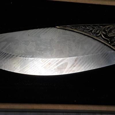 10 in fixed blade wolf decor blade is 400 ga. / China. $15 to $30.