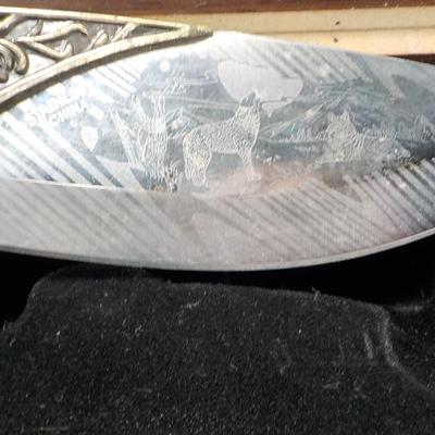 10 in fixed blade wolf decor blade is 400 ga. / China. $15 to $30.