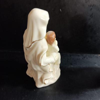 Porcelain religious figures -- Nunn -- girl praying with sheep -- and lady holding child.