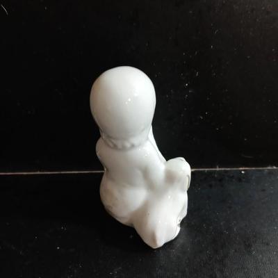 Porcelain religious figures -- Nunn -- girl praying with sheep -- and lady holding child.