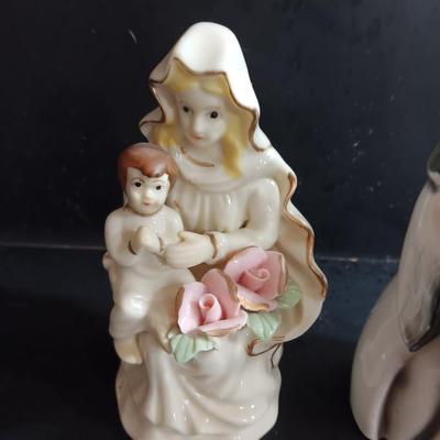 Porcelain religious figures -- Nunn -- girl praying with sheep -- and lady holding child.