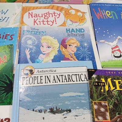 Variety of Children's books. Coloring booklet and crayons