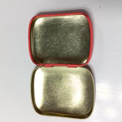 Six glass Coca Cola bottles and small coca cola collectible tin