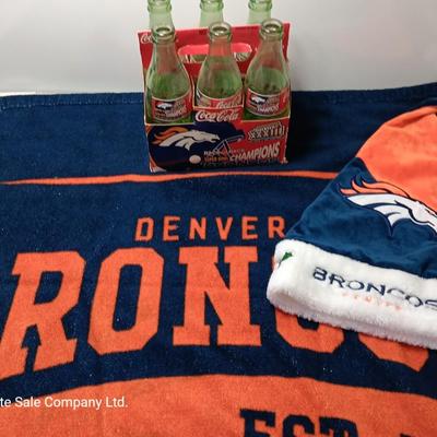 Denver Bronco's Back-to-Back Superbowl coca cola bottles in case with a Bronco's towel and Christmas hat