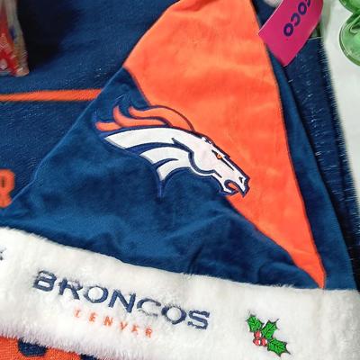 Denver Bronco's Back-to-Back Superbowl coca cola bottles in case with a Bronco's towel and Christmas hat