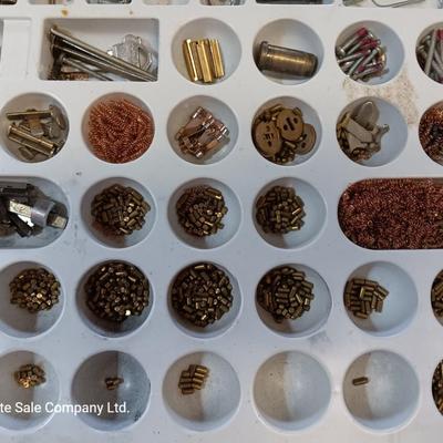 Metal box full of Wesklock keying kit hardware