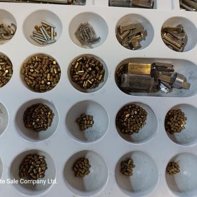 Metal box full of Wesklock keying kit hardware