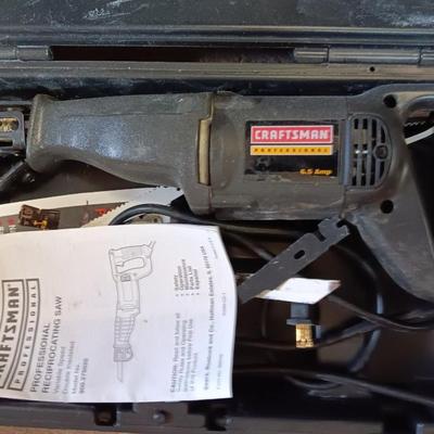 Craftsman Electric reciprocating saw in case with extra blades and gloves
