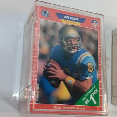 Football cards in plastic cases