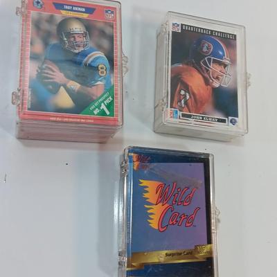 Football cards in plastic cases