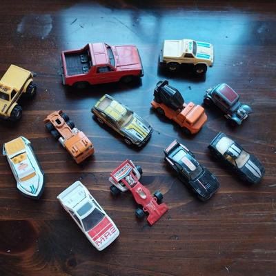 AN ASSORTMENT OF VINTAGE TOY CARS