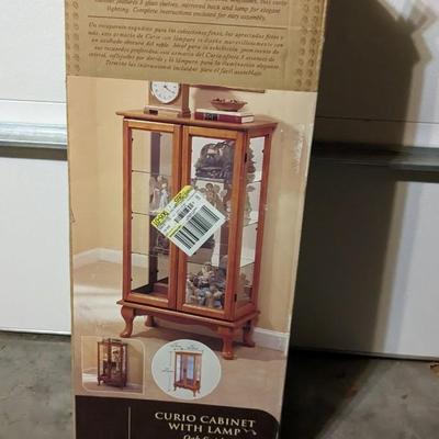 New in Box Lighted Curio Cabinet