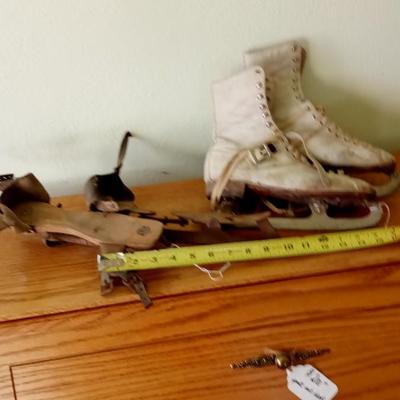 LOT 12 TWO OLD SETS OF ICE SKATES