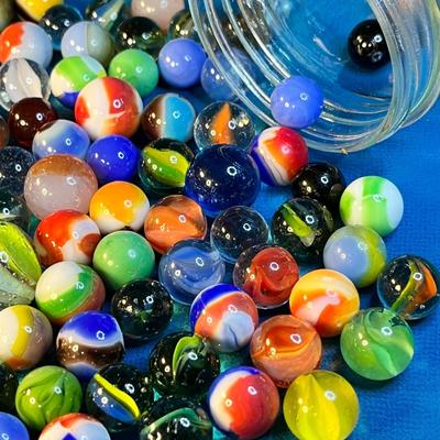 HALF PINT JAR FULL OF ASSORTED MARBLES