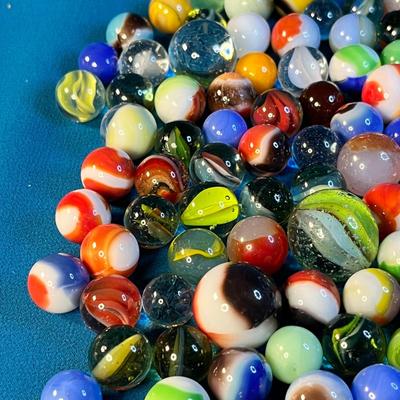 HALF PINT JAR FULL OF ASSORTED MARBLES