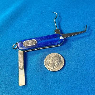 AVON SMALL POCKET KNIFE-LIKE MULTI-TOOL: TWEEZERS, MIRROR, BRUSH, PICK, ETC.