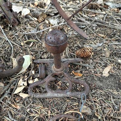 ANTIQUE IRON HAND CULTIVATOR WITH AN OLD PULLEY