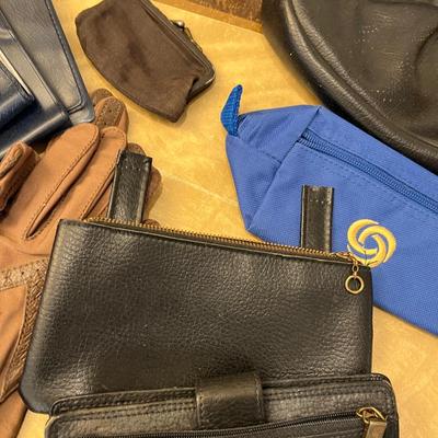 Lot of bags, wallets, checkbook covers, and other