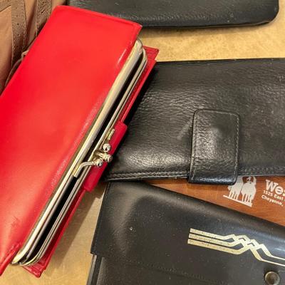 Lot of bags, wallets, checkbook covers, and other