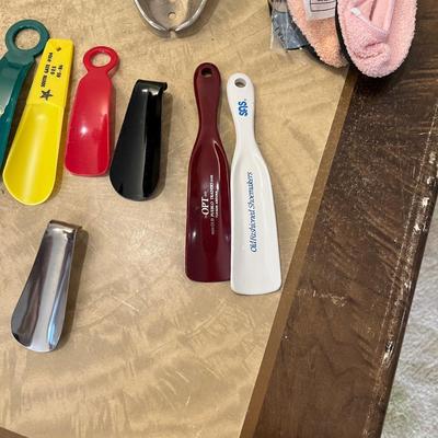 Shoe horns, stretchers, and shoe laces