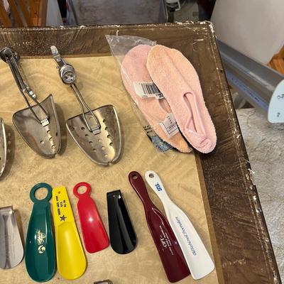 Shoe horns, stretchers, and shoe laces