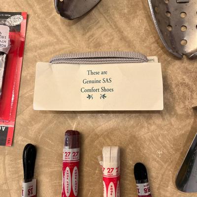 Shoe horns, stretchers, and shoe laces