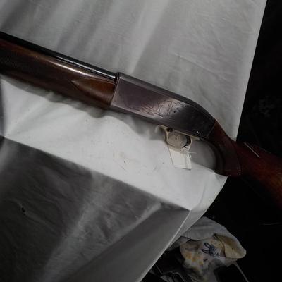 Winchester Model  59 12 gauge shot gun/semi-auto RIOT gun. est.$300 to $700.