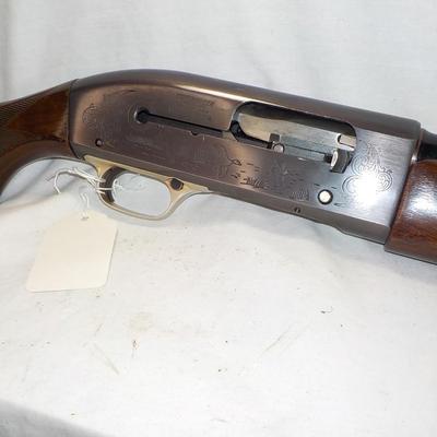 Winchester Model  59 12 gauge shot gun/semi-auto RIOT gun. est.$300 to $700.