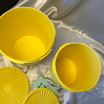 Yellow Tupperware canisters
