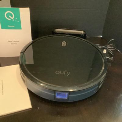 245 Robo Vac Eufy Room Vac with charging station and manuel