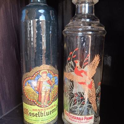 Beameister Noselbluemhen crock bottle with Old Fitzgerald Prime Wildlife glass bottle