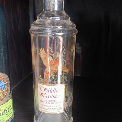 Beameister Noselbluemhen crock bottle with Old Fitzgerald Prime Wildlife glass bottle