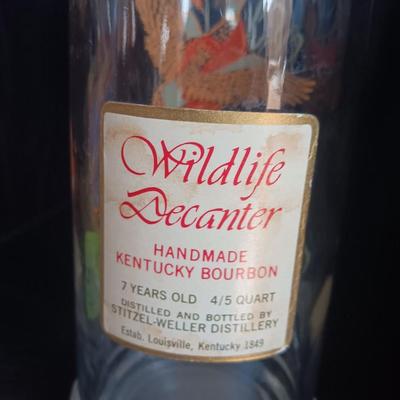 Beameister Noselbluemhen crock bottle with Old Fitzgerald Prime Wildlife glass bottle