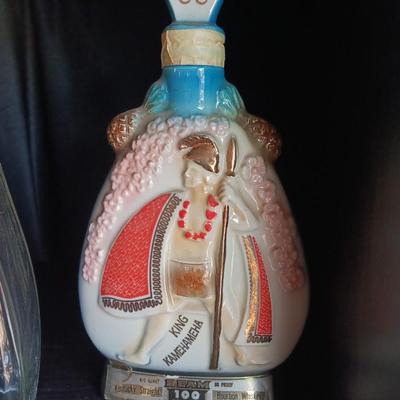 Old Charter bottle and Jim Beam King Kamehameha Decanter