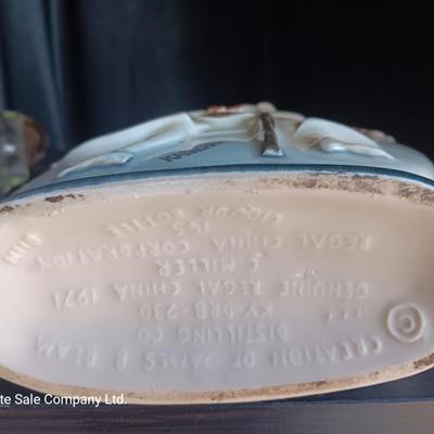 Old Charter bottle and Jim Beam King Kamehameha Decanter