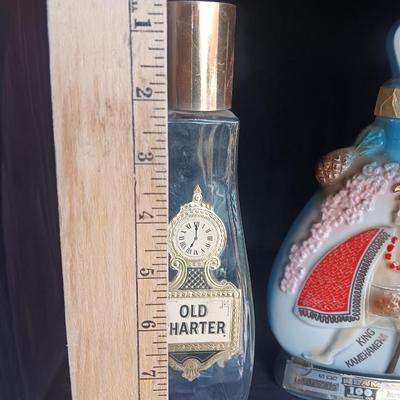 Old Charter bottle and Jim Beam King Kamehameha Decanter