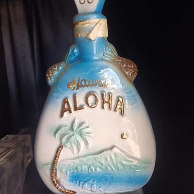 Old Charter bottle and Jim Beam King Kamehameha Decanter