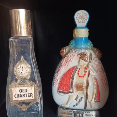Old Charter bottle and Jim Beam King Kamehameha Decanter