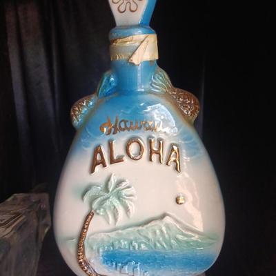 Old Charter bottle and Jim Beam King Kamehameha Decanter